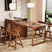 Dining room with wooden freestanding cabinet Murphy dining table and chairs in a well-lit room.